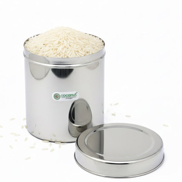 Stainless steel container with rice on a white background